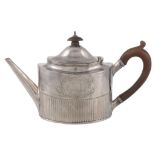 A George III silver straight-sided oval tea pot by Robert Hennell I,   London 1794, with a wooden