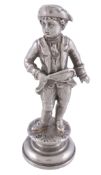 [Tennis interest] A 19th century silver coloured figural desk seal,   modelled as a gentleman in