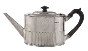 An Edwardian silver straight-sided oval tea pot by Horace Woodward  &  Co. Ltd,   London 1902, with