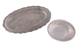 A Chilean silver coloured shaped oval plate,   stamped marks, 25cm (9 3/4in) long; and an Argentine