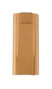 Cartier, a gold plated gas lighter,   no. 256298, circa 1991, with reeded decoration, in a Cartier