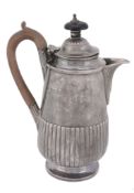 A Victorian silver hot water pot by Charles Stuart Harris,   London 1881, with a composition finial