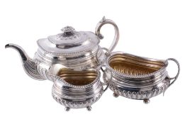 A late George III Scottish silver oblong baluster three piece tea service,   mark of Mitchell  &