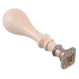 A Victorian turned ivory desk seal,   with a rounded tapering knop, with a white alloy head and