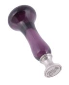 A 19th century silver and purple glass desk seal,   with a rounded pommel and waisted stem, the