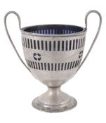 A silver twin handled sugar basket,   unmarked, late 18th century, with a blue glass liner, 16cm (6
