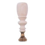 A Victorian turned ivory mounted desk seal,   the reeded cushion with a chased floral border, the