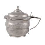 A George III silver oval baluster mustard pot by Alexander Field,   London 1804, with a ball finial
