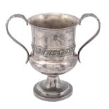 A George IV silver twin handled cup by J. E. Terrey  &  Co.,   London 1822, with leaf-capped S-