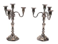 A pair of electroplated hexalobed three branch four light candelabra,   mid 20th century, 36cm (15