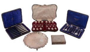 Three cased sets of silver spoons,   comprising: twelve Edwardian engraved Old English pattern with