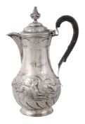 A Victorian Irish silver baluster hotwater pot by West  &  Son,   Dublin 1899, with a scroll