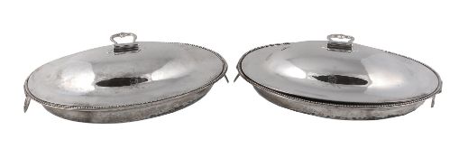 A pair of George III silver oval entree dishes and covers,   the bases by Thomas Heming, London
