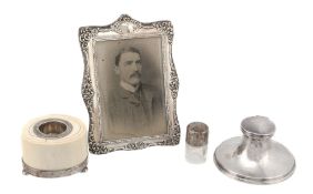 Four silver mounted items,   comprising: a late Victorian shaped rectangular and embossed