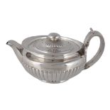 A George III silver cape pattern tea pot by William Burwash  &  Richard Sibley,   London 1807, with