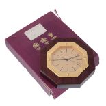 Asprey, an octagonal wall clock,   quartz movement, no. 1851985, gold dial, baton markers, sword