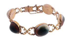 A Victorian operculum and gold bracelet  , circa 1880, the operculum panels interspaced with