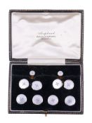 A mother of pearl gentleman's dress set,   comprising: a pair of mother of pearl cufflinks, the