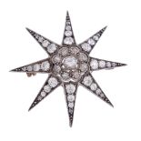 A late Victorian diamond star brooch  , circa 1880, the old cut diamonds in a gold backed silver