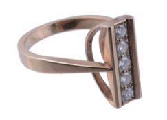 A diamond dress ring,   the vertical row of five brilliant cut diamonds between two polished bars,