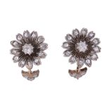 A pair of diamond flower head earrings,   circa 1900,    the flower head clusters set with a