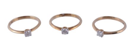 Three diamond single stone rings,   each ring with a brilliant cut diamond estimated to weigh 0.22