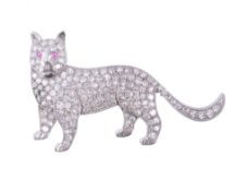 A diamond cat brooch,   the standing cat set throughout with eight cut and old cut diamonds, the