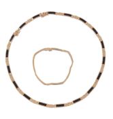 A black coral necklace,   the articulated necklace set with rectangular panels of black coral, with