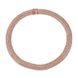 A gold coloured necklace,   the articulated necklace composed of polished woven links, to a