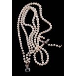 A three strand cultured pearl necklace,   composed of three strands of slightly graduated cultured