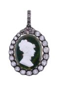 A Victorian paste set pendant,   circa 1880, the oval bloodstone panel with an applied white paste