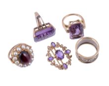 An amethyst ring,   the rectangular shaped amethyst in a four claw setting, stamped 14K, finger