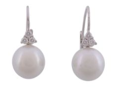 A pair of diamond and South Sea cultured pearl earrings  , the cultured pearls measuring 12mm