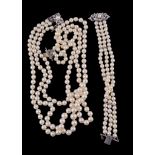 A cultured pearl necklace,   the three strands composed of graduating cultured pearls, to a