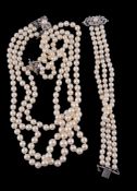 A cultured pearl necklace,   the three strands composed of graduating cultured pearls, to a