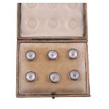 A set of six buttons  , circa 1910, the buttons each centred with a circular mother of pearl panel