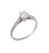 A diamond ring,   the old cut diamond, estimated to weigh 0.35 carats, claw set between eight cut
