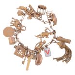 A gold coloured charm bracelet,   the fancy belcher links suspending various charms, including