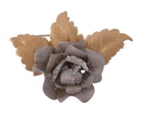 A two colour rose brooch by Fabbrini  , the white coloured metal flower head with brilliant cut