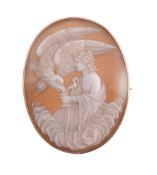 A late Victorian shell cameo brooch,   circa 1890, the oval cameo carved with Hebe and the eagle,