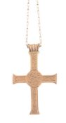 A cross pendant,   circa 1993, engraved with the Lamb of God between  the Greek letters Alpha and