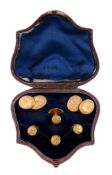 A pair of gold coloured double sided cufflinks,   the  oval panels with engraved foliate