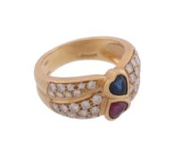 A ruby, sapphire and diamond ring,   centrally set with a heart shaped ruby and a heart shaped