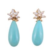 A pair of turquoise and diamond earrings,   the polished turquoise drops suspended below a diamond