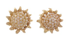 A pair of diamond flower head earrings,   designed as a sunflower head, set with a central cluster