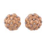 A pair of diamond earrings,   the textured clusters accented with brilliant cut diamonds, with post