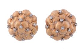 A pair of diamond earrings,   the textured clusters accented with brilliant cut diamonds, with post