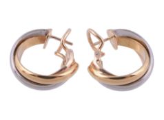 A pair of Trinity ear hoops by Cartier  , the three colour hoops signed Cartier and numbered MJ