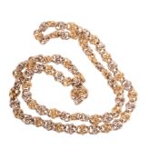 A gold coloured chain,   composed of fancy curb links, to a concealed clasp, stamped 750 with