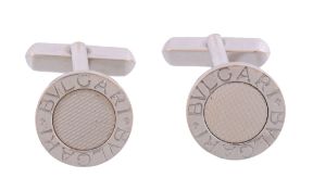 A pair of cufflinks by Bulgari,   the circular terminals with a signed border with a textured